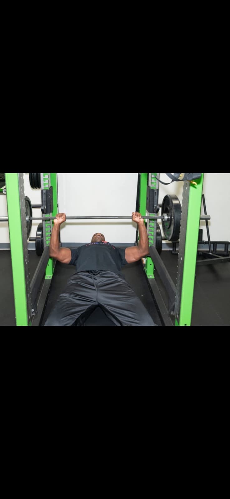 Coach Len bench pressing in the gym